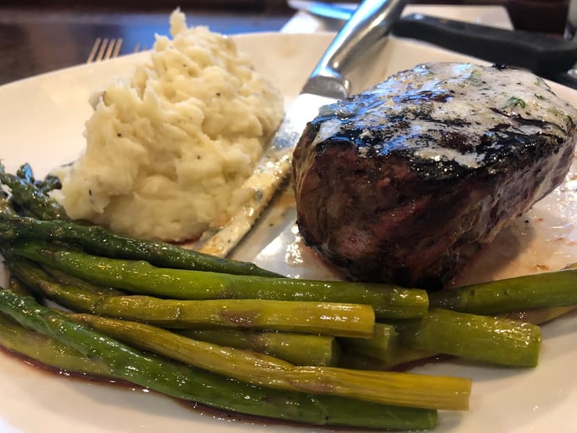 thick steak with mashed potatoes and asparagus