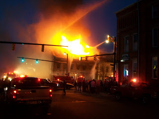 flames from a downtown building fire at night