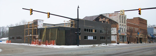 modern building under construction on corner lot