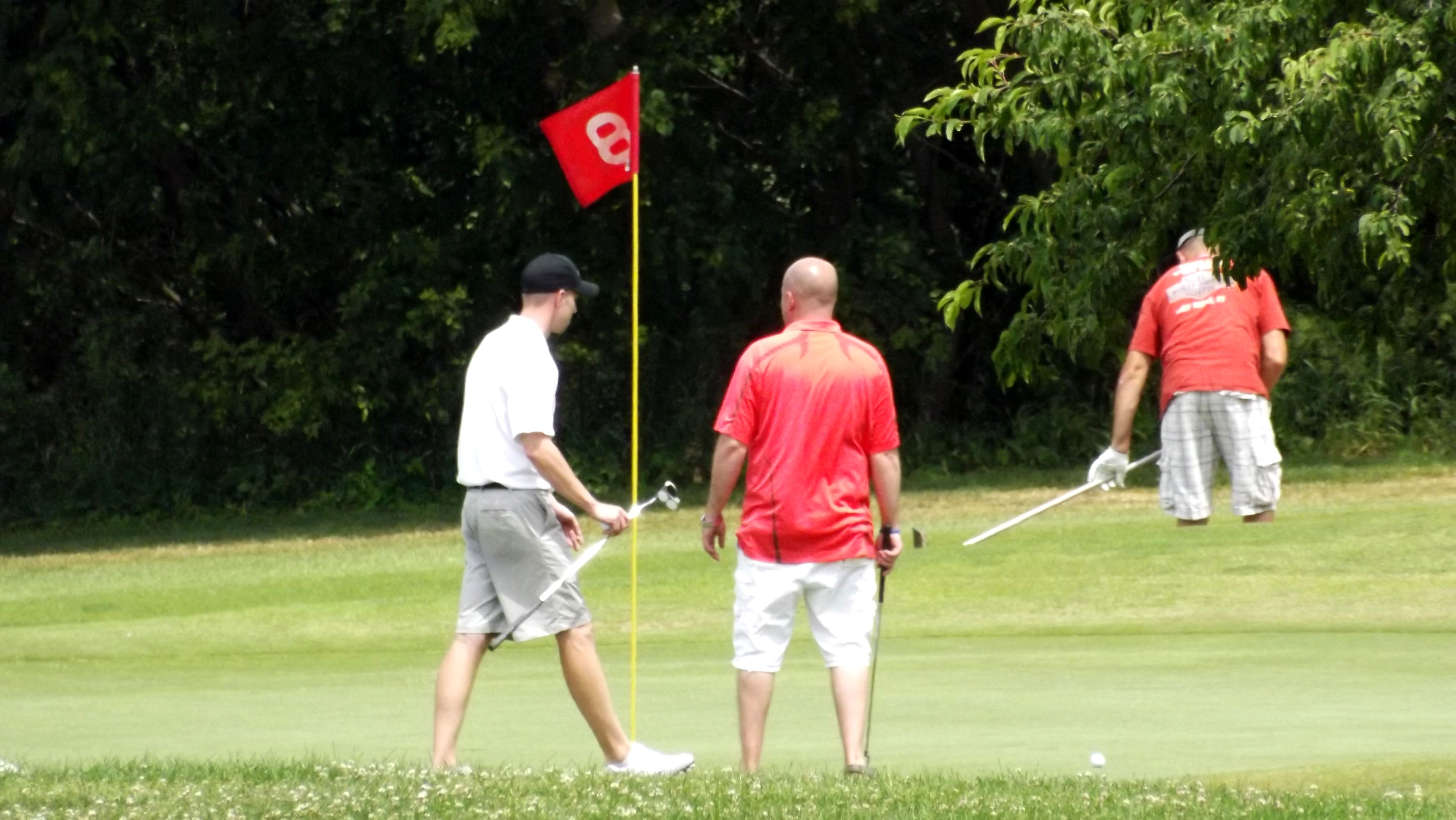 men on golf course