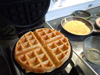 waffle iron with lightly browned waffle