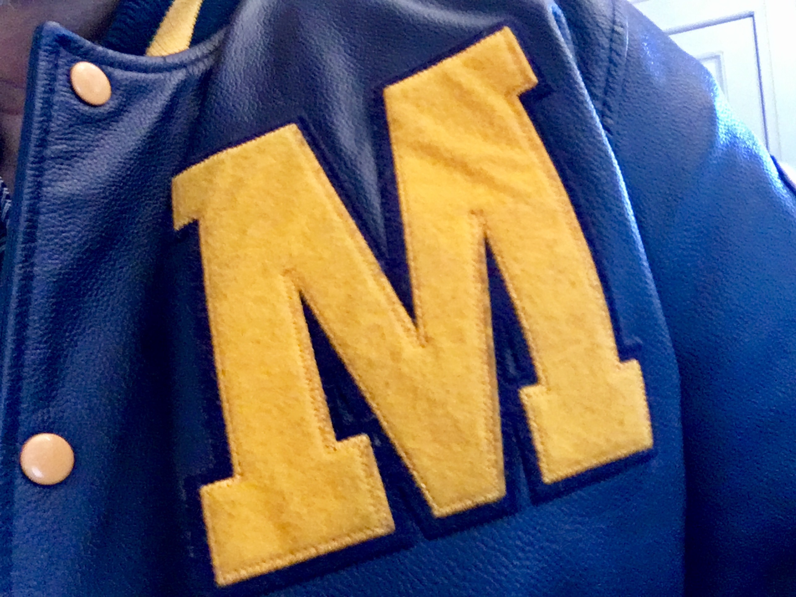 University of Michigan letterman jacket logo