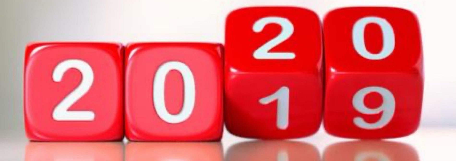 4 Red dice with white numbers showing 2019 changing to 2020