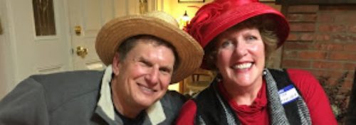 man with woman in red hat