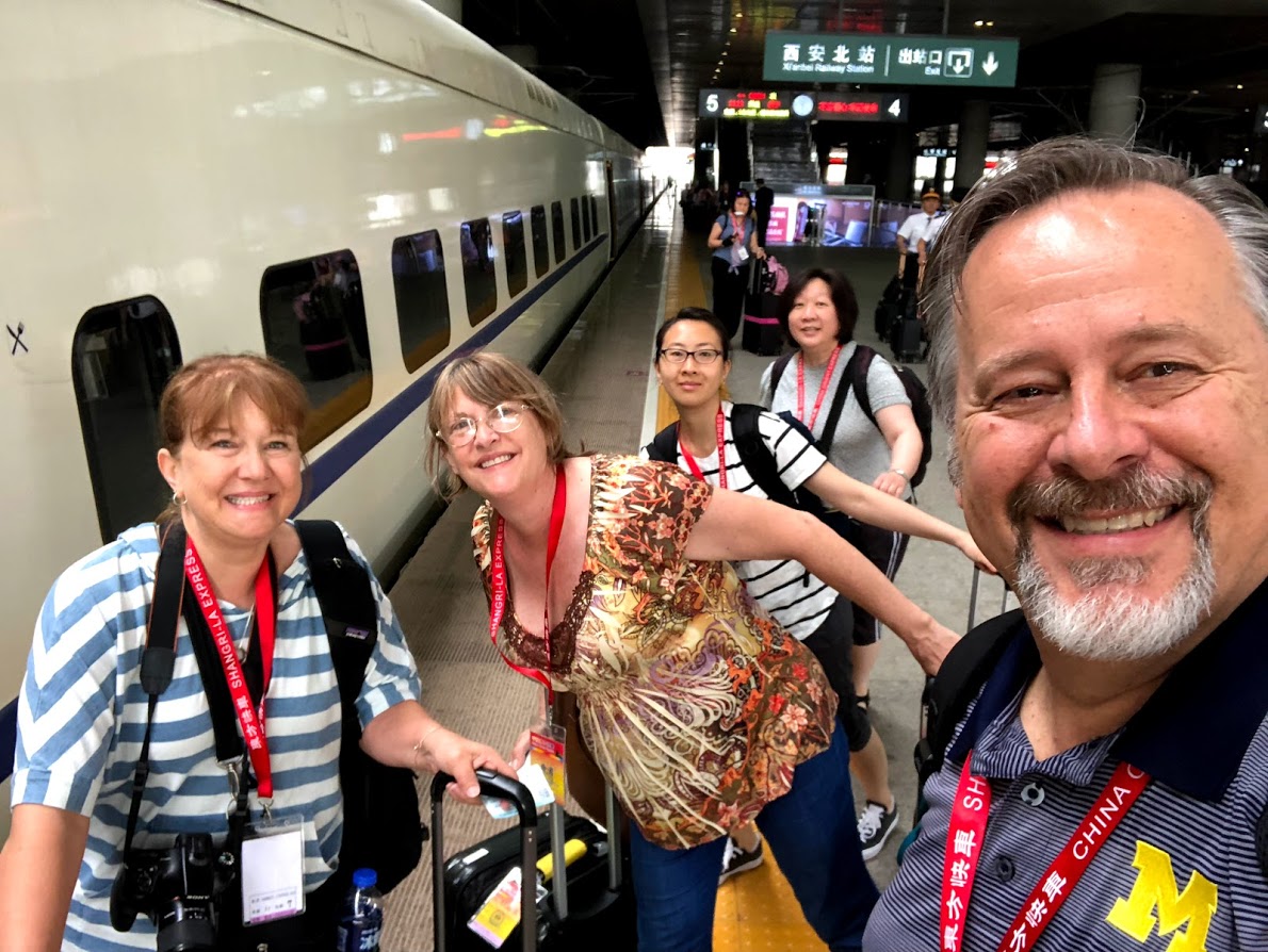 5 tourists about to board and Orient Express train